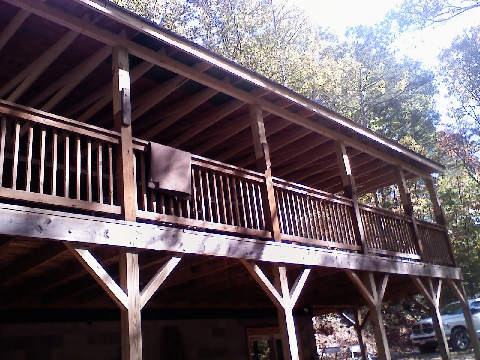 Timber framing under a new elevated porch and deck — Roof Leak Repair in Grain Valley by Roofing Brothers